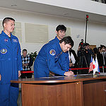 CG4G8895 --- (6 May 2015) --- At the Gagarin Cosmonaut Training Center in Star City, Russia, Expedition 44/45 Soyuz Commander Oleg Kononenko of the Russian Federal Space Agency (Roscosmos) signs in for the first of two days of qualification exams May 6 as