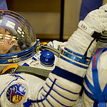 In the Integration Facility at the Baikonur Cosmodrome in Kazakhstan, Expedition 44 crew member Kimiya Yui of the Japan Aerospace Exploration Agency undergoes a pressure and leak check of his Sokol launch and entry suit July 11 as part of a fit check dress rehearsal. Yui, Kjell Lindgren of NASA and Oleg Kononenko of the Russian Federal Space Agency (Roscosmos) will launch July 23, Kazakh time from Baikonur in their Soyuz TMA-17M spacecraft for a five-month mission on the International Space Station. Credit: Gagarin Cosmonaut Training Center